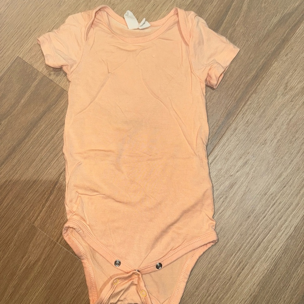 Kyte Baby Short Sleeve Bodysuit in Papaya